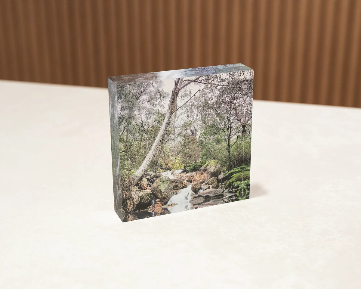 Mountain Flow. Acrylic block Mount Buffalo National Park Victoria, sitting on a desk.