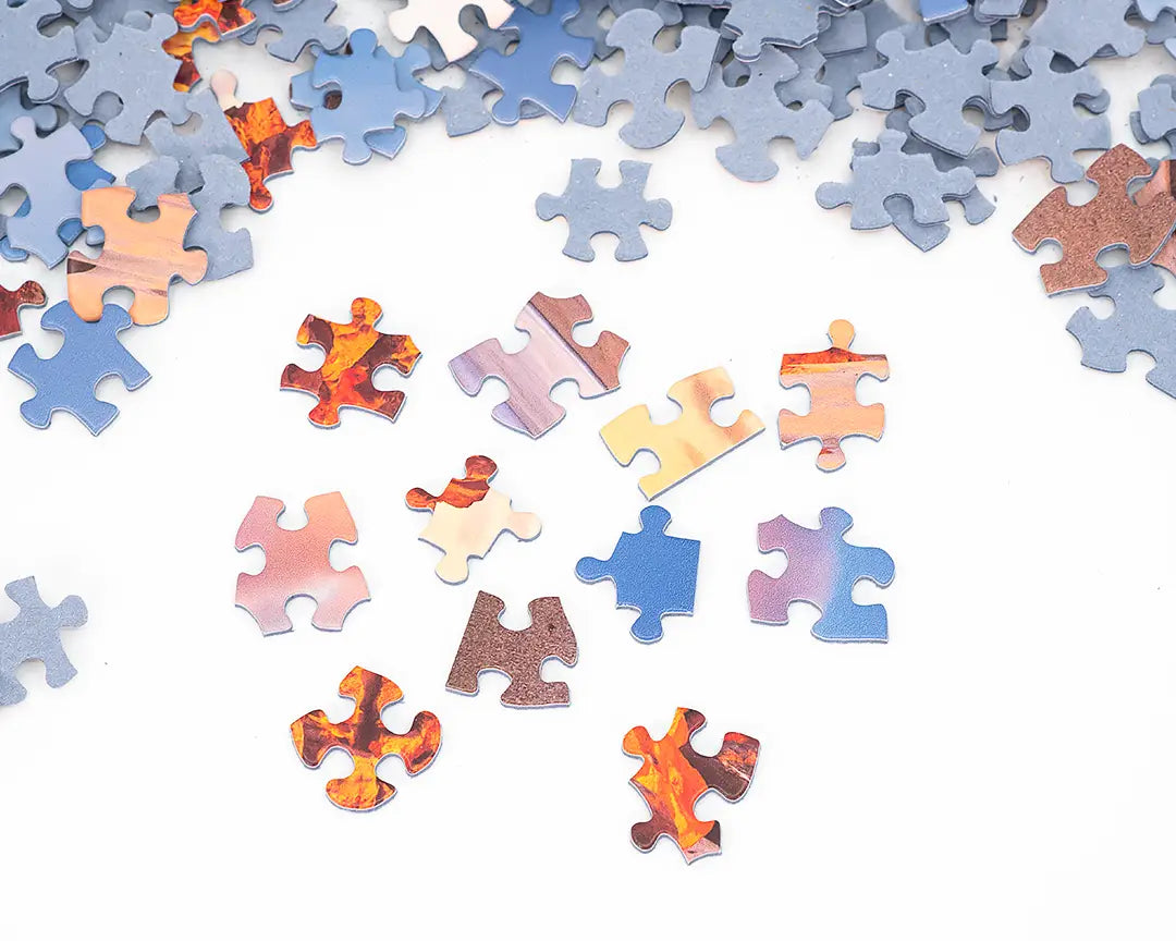 multiple uniquely cut jigsaw puzzle pieces.