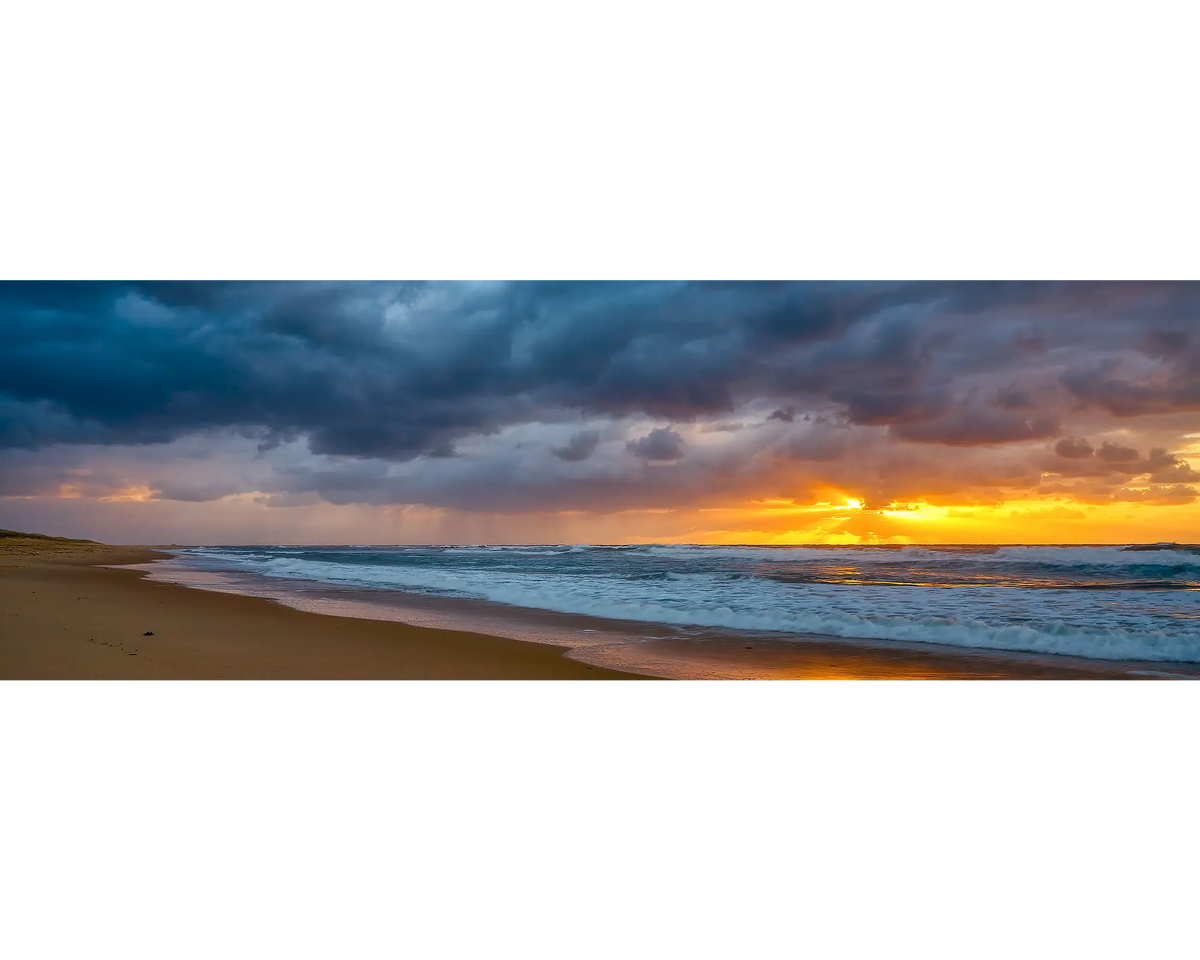 Newcastle Awakening. Stormy sunrise at Nobby&#39;s Beach, Newcastle, New South Wales, Australia.