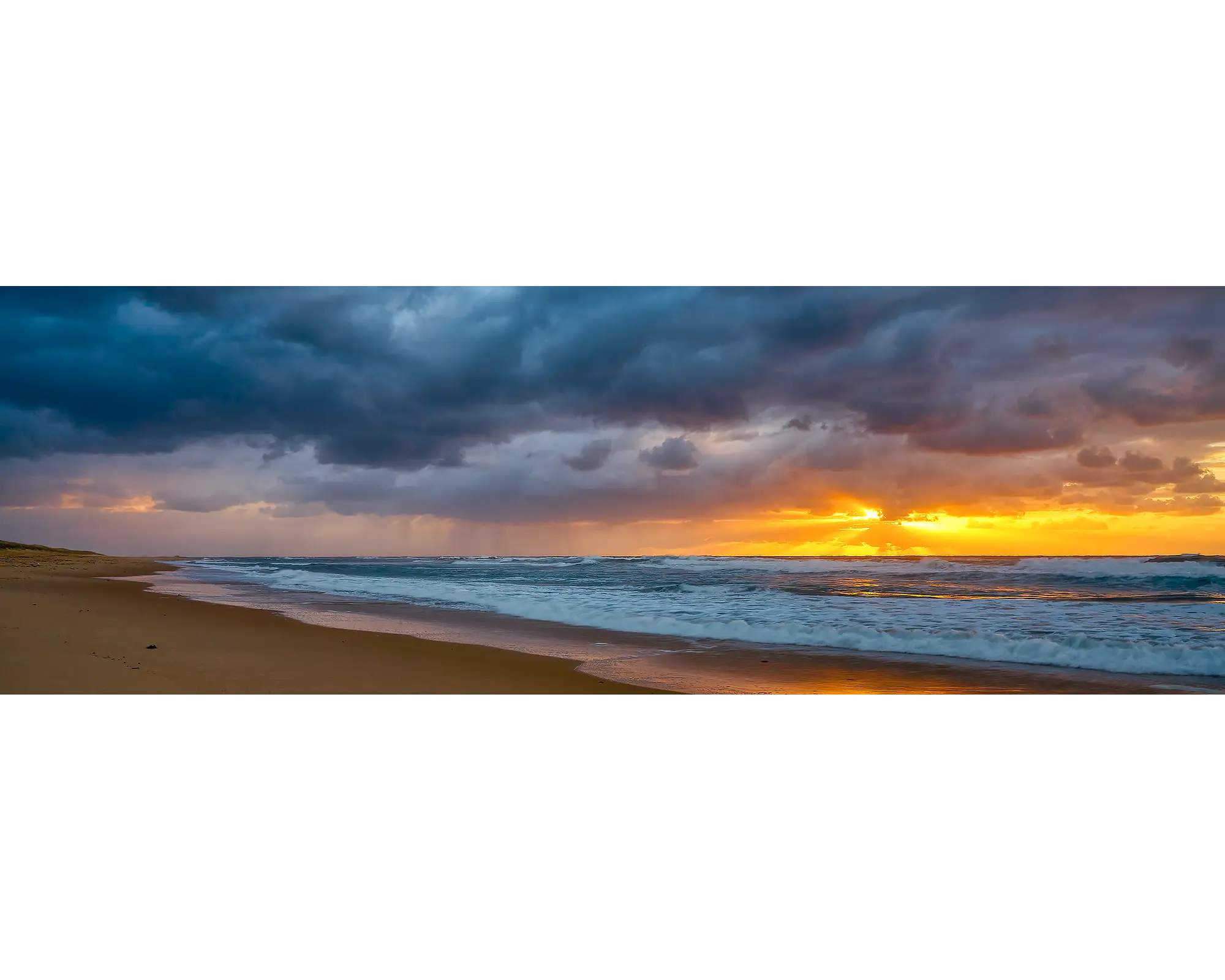 Newcastle Awakening. Stormy sunrise at Nobby's Beach, Newcastle, New South Wales, Australia.