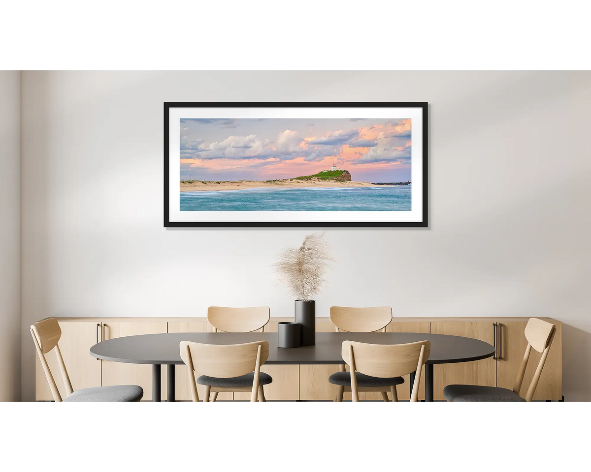Newcastle Magic. Photographic wall art print of Nobbys beach, Newcastle, with a black frame and hung on a dining room wall