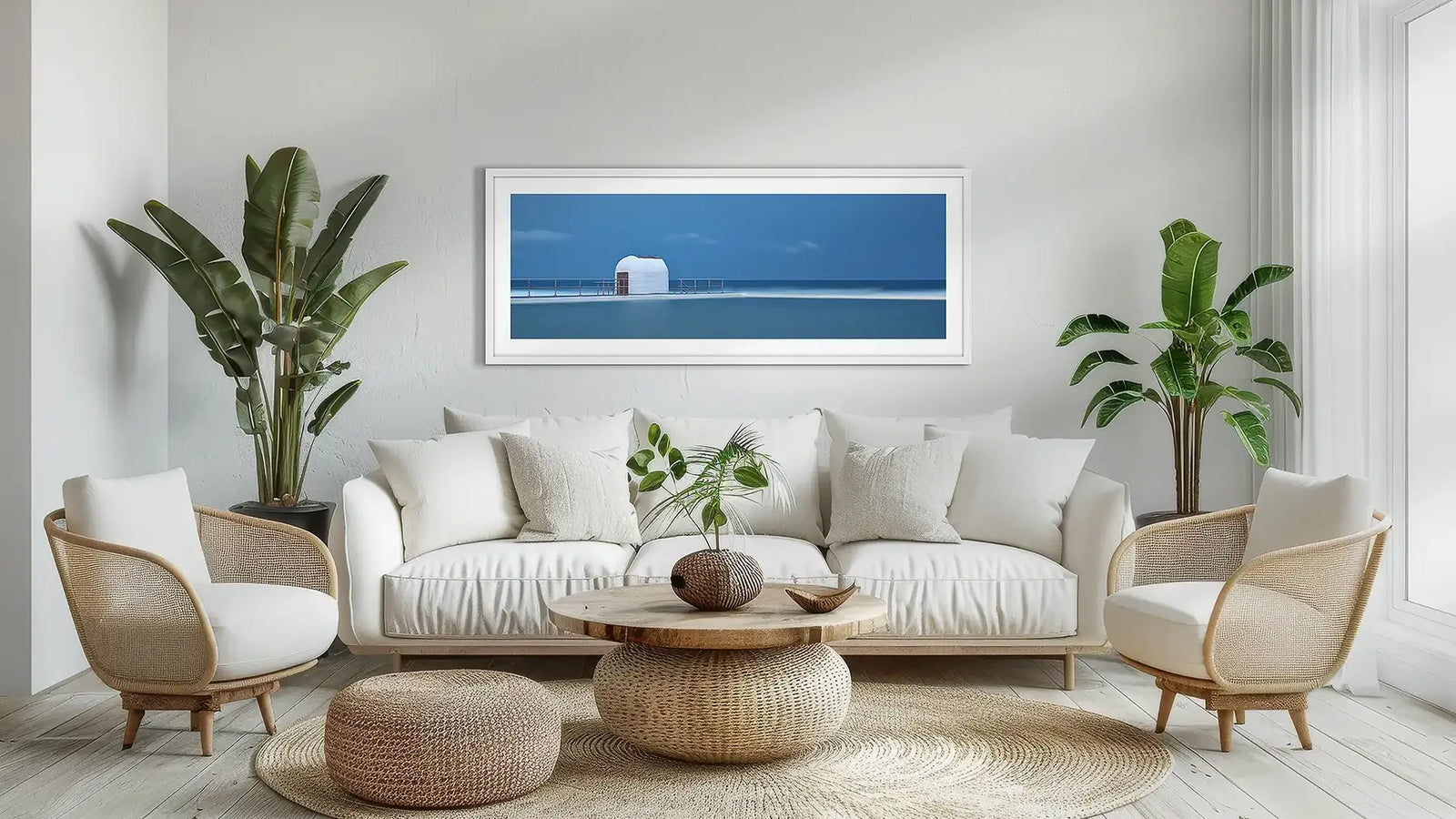 Newcastle wall art print with white frame above couch.