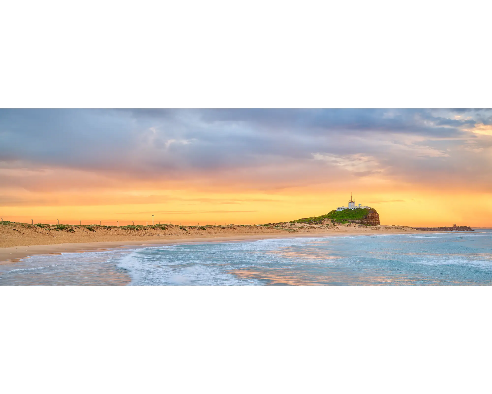 Nobbys Gold. Golden light at sunrise over Nobbys Beach, Newcastle.