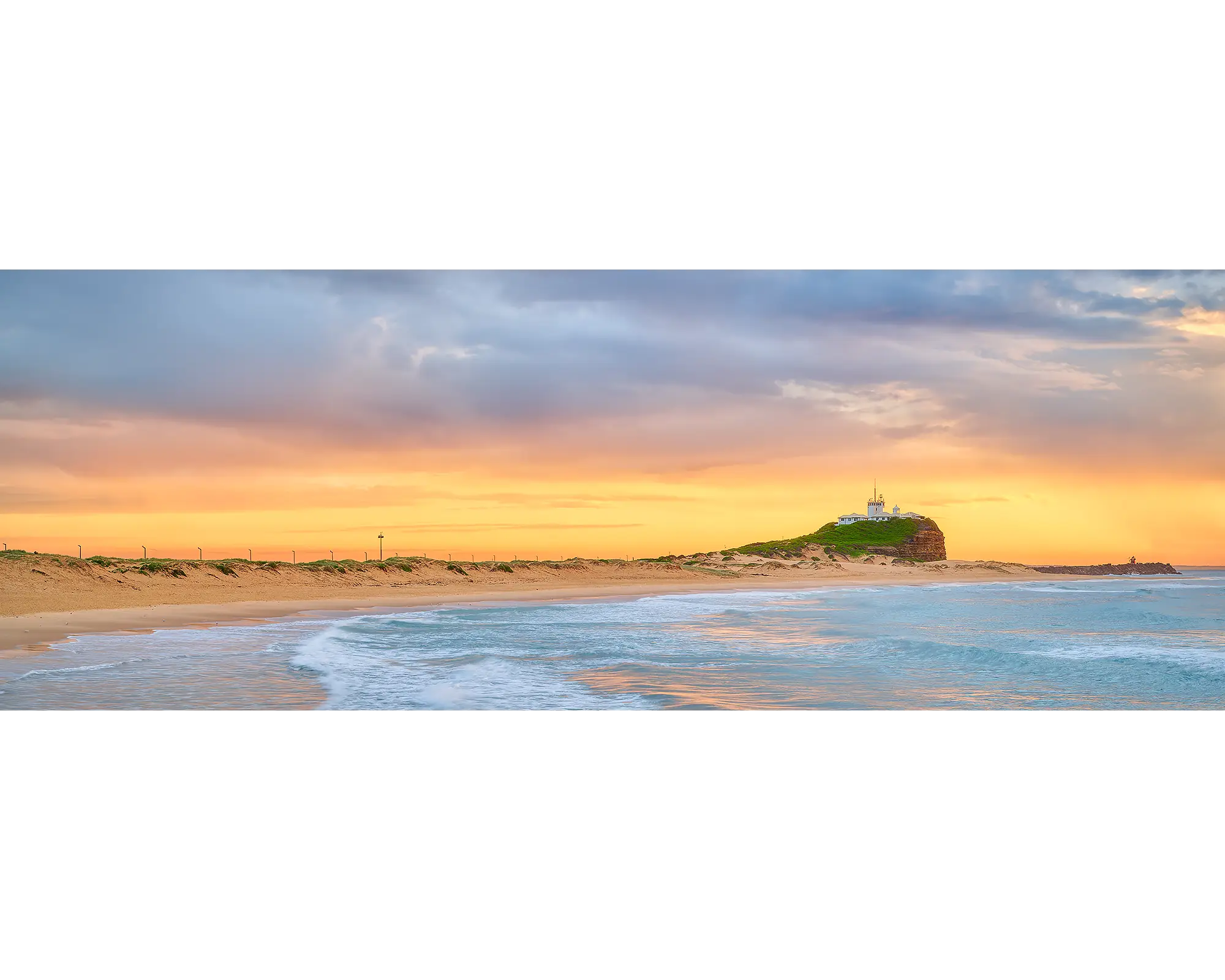 Nobbys Gold. Golden light at sunrise over Nobbys Beach, Newcastle.