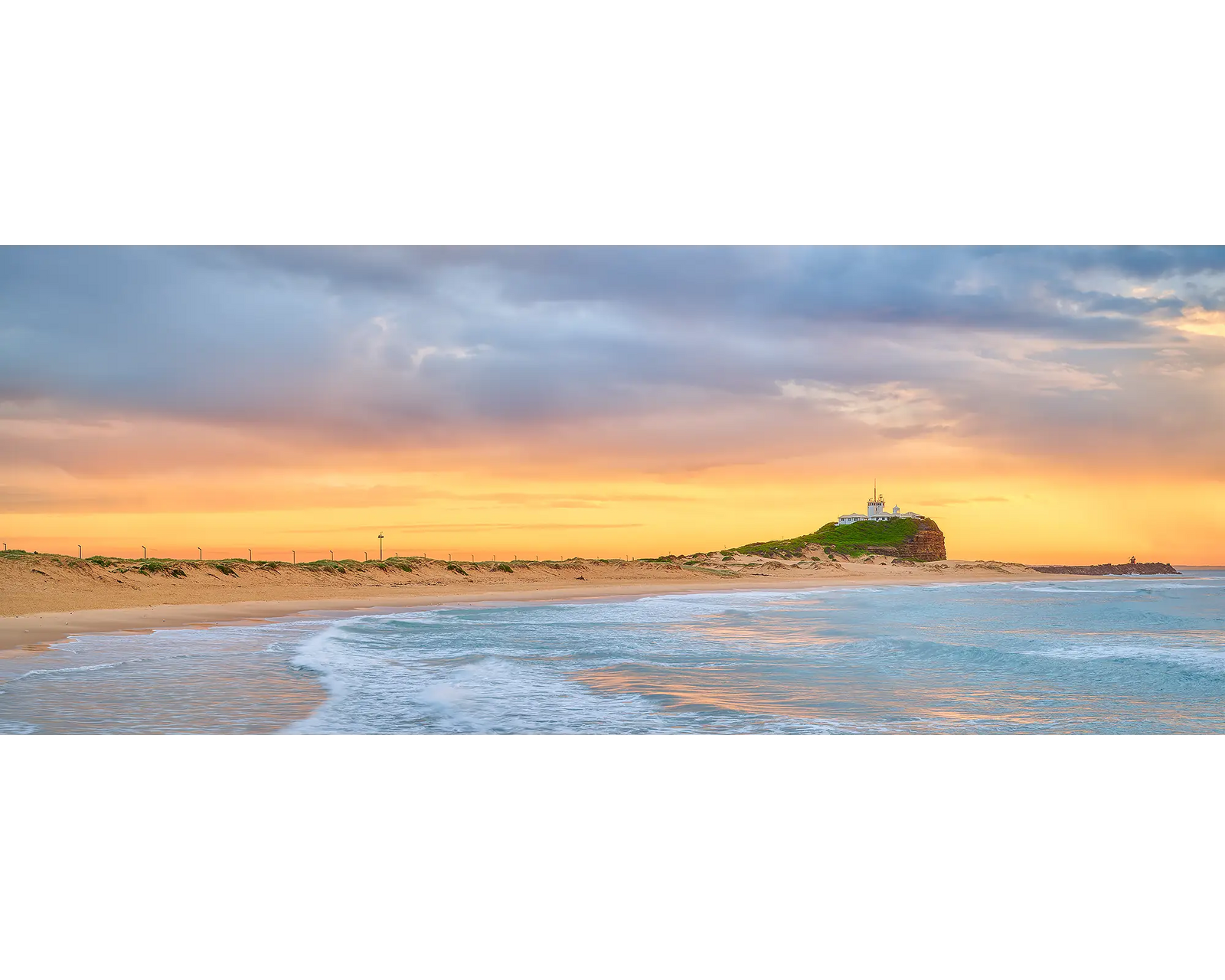 Nobbys Gold. Sunrise with golden light at Nobbys Beach, Newcastle.