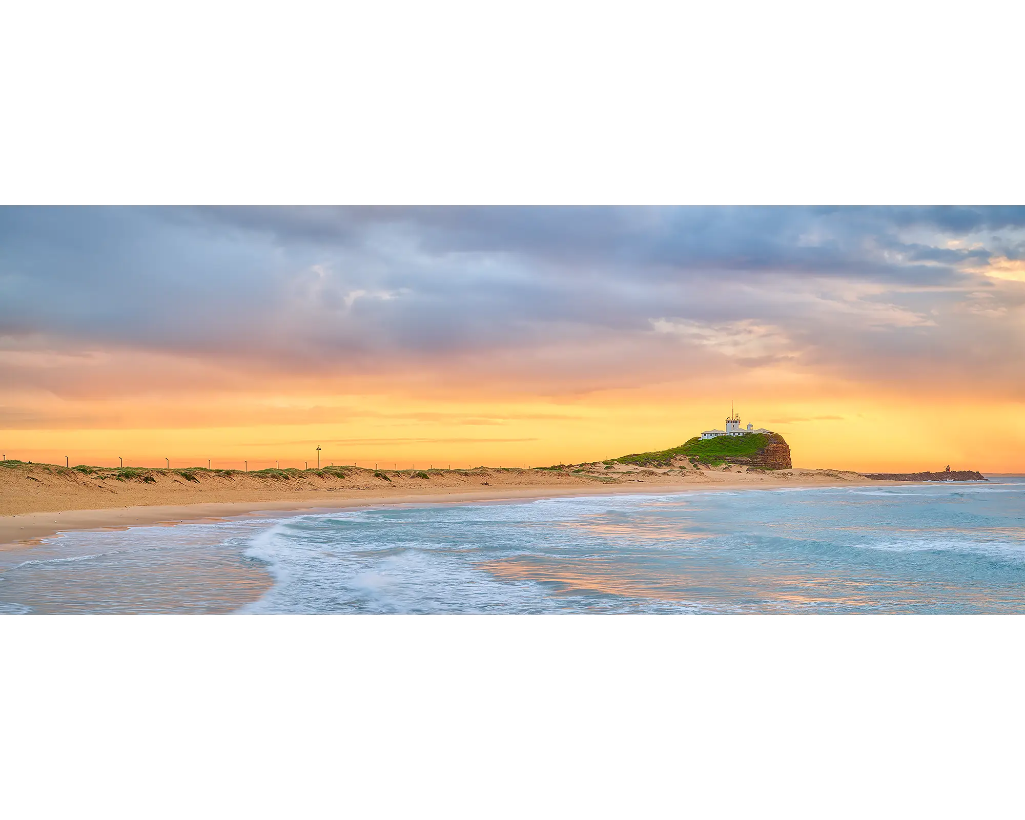 Nobbys Gold. Sunrise with golden light at Nobbys Beach, Newcastle.