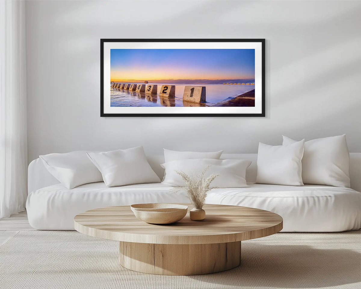Numbers. Black framed, Merewether Baths, wall art print, hung in a scandi-themed lounge room.