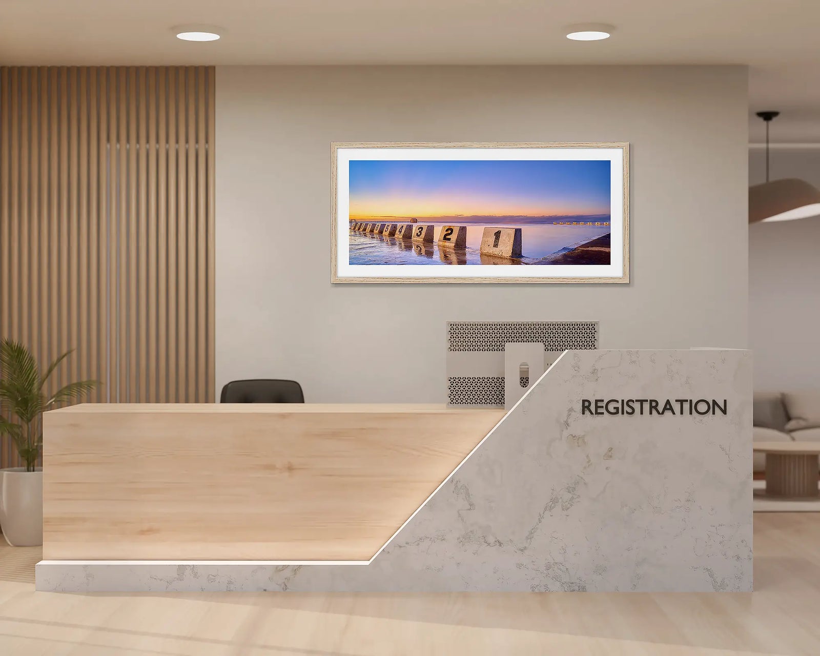 Framed coastal wall art print of a gold sunrise reflecting in the ocean water at Merewether Baths in Newcastle. 