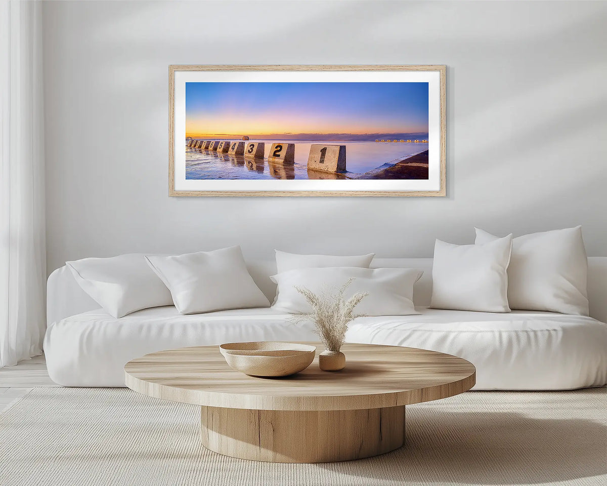 Numbers. Timber framed, Merewether Baths, wall art print, hung in a scandi-themed lounge room.