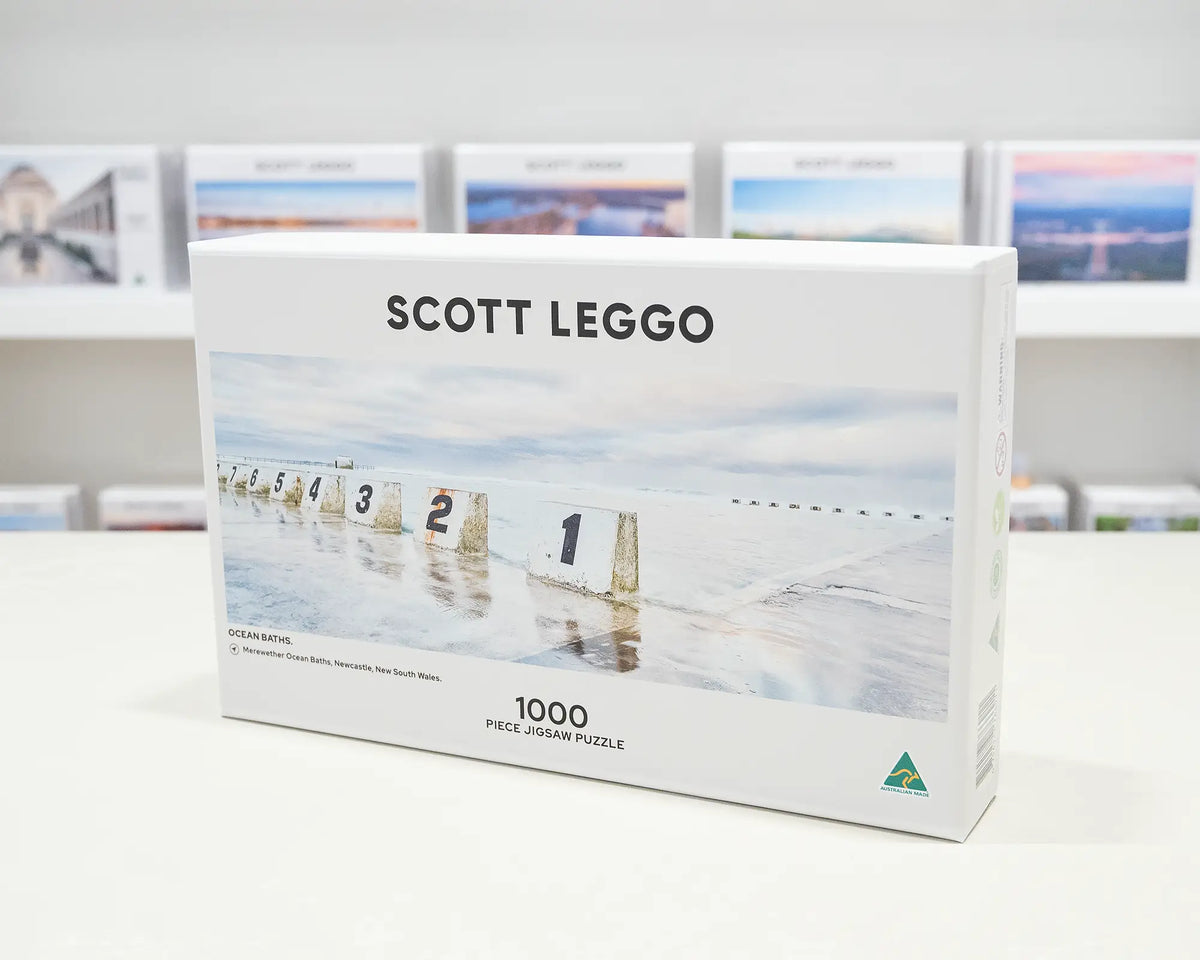 Ocean Baths. 1000 piece jigsaw puzzle of Merewether Ocean Baths, Newcastle, on a desk in the gallery