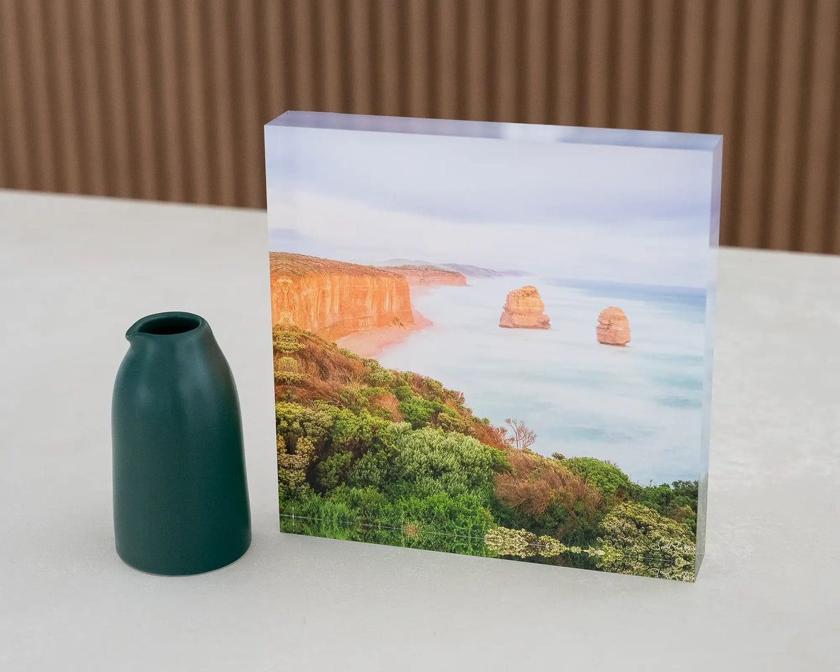 Ocean Blur. Acrylic block Great Ocean Road, Victoria, on desk styled with small vase.