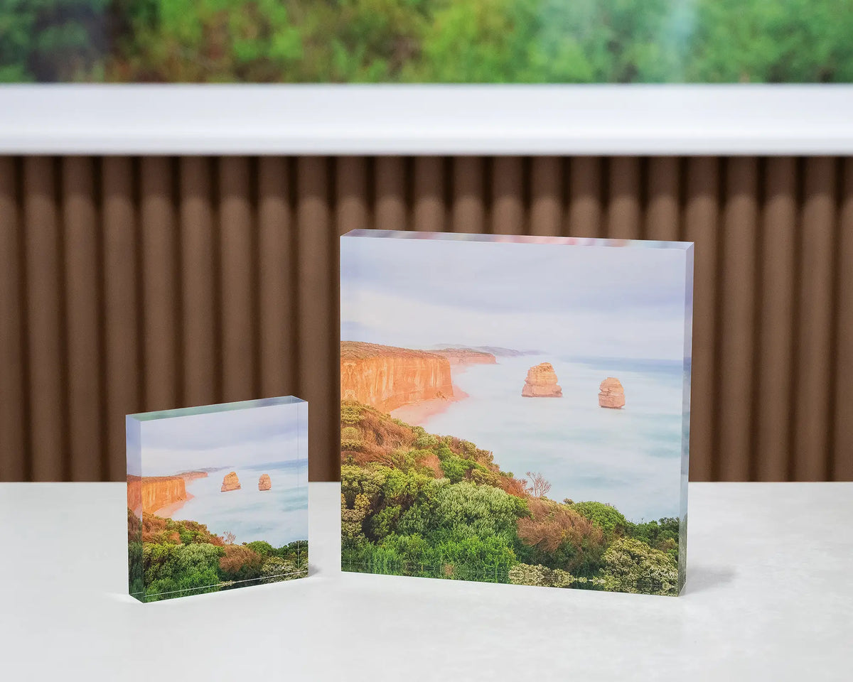 Ocean Blur. Great Ocean Road, Victoria, acrylic blocks 10cm and 19cm, on desk with large SCOTT LEGGO artwork in background.
