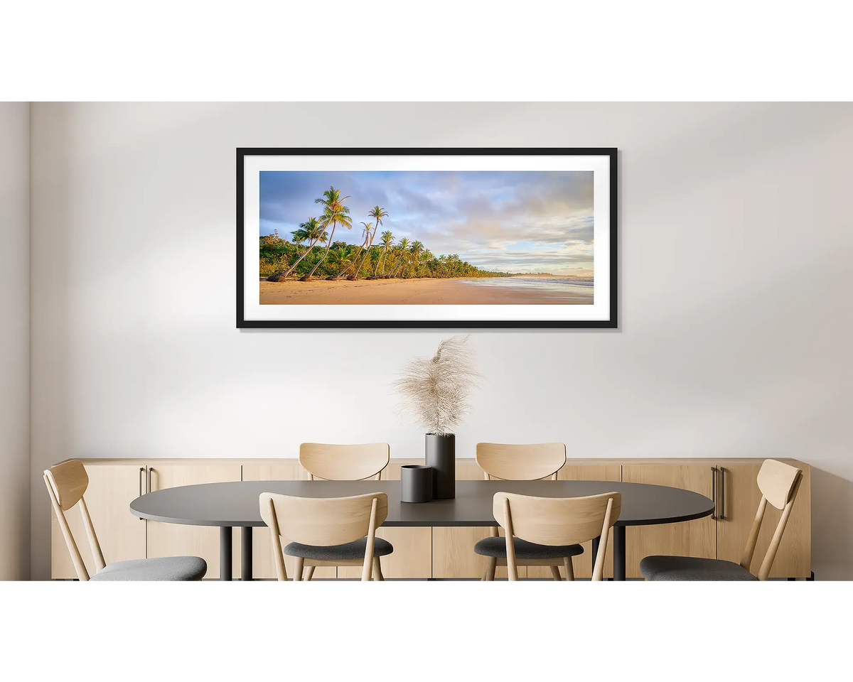 Ocean Breeze. Photographic wall art print of Mission beach, Queensland, with a black frame, hung on a dining room wall