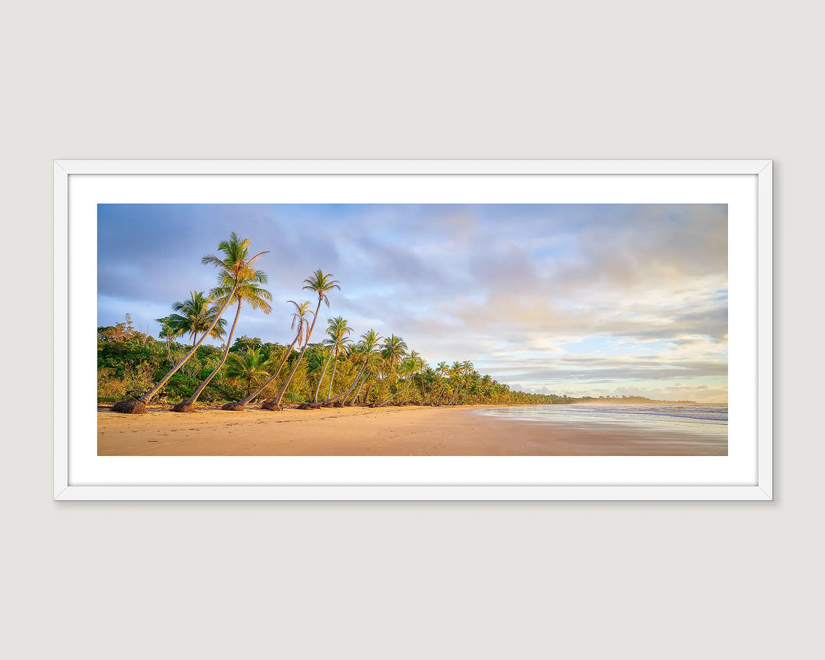 Framed landscape photograph of a tropical beach with palm trees.