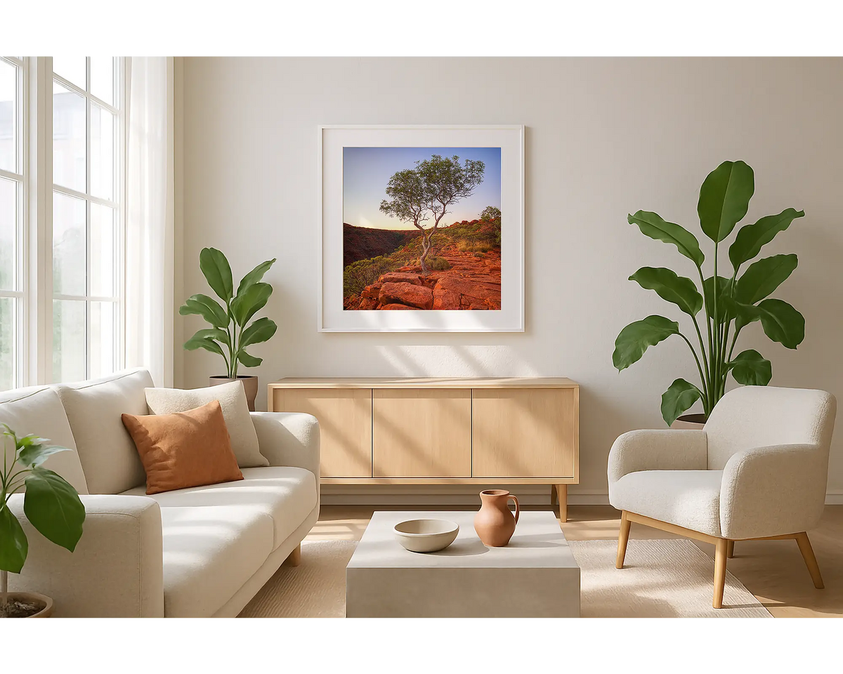 On the edge. Wall art print of Kings Canyon, Northern Territory, with a white frame hung in a sunlit lounge room. 