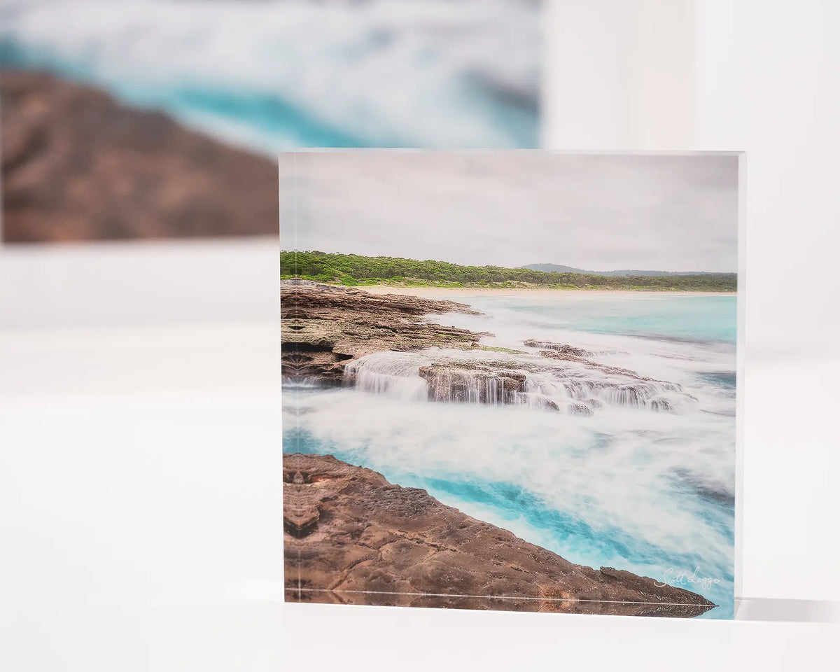 On The Rocks. Acrylic block South Durras Beach, Eurobodalla, New South Wales, with print in background.