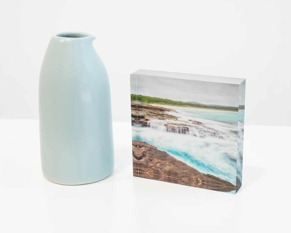 On The Rocks. Acrylic block South Durras beach, on desk styled with a small vase.