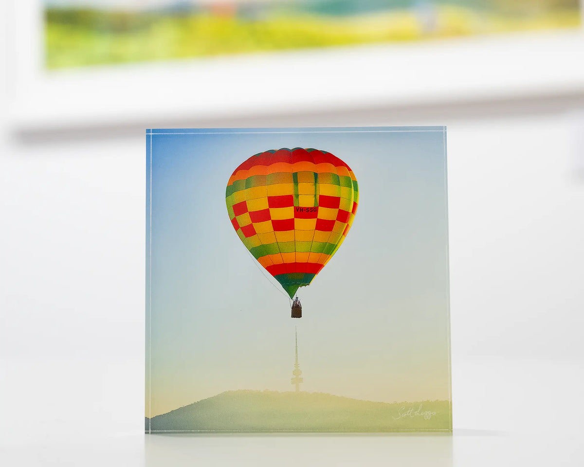 On Top. Acrylic block of a hot air balloon flying over Black Mountain Tower, during the Canberra balloon festival.