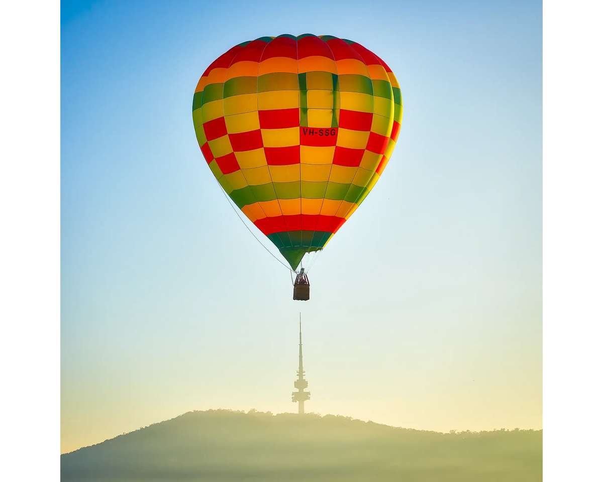 Hot air balloon flying over Black Mountain Tower, Canberra.