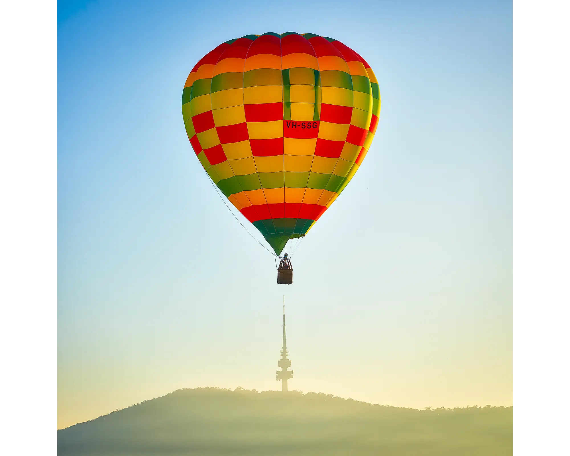 Hot air balloon flying over Black Mountain Tower, Canberra.