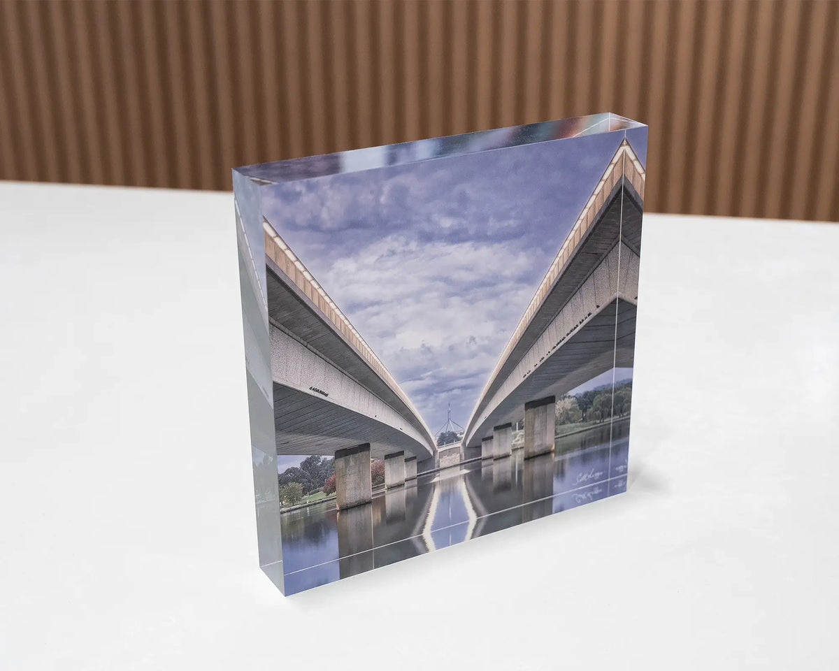 One Direction. Acrylic block of the Commonwealth Avenue Bridge, Canberra, sitting on a desk.