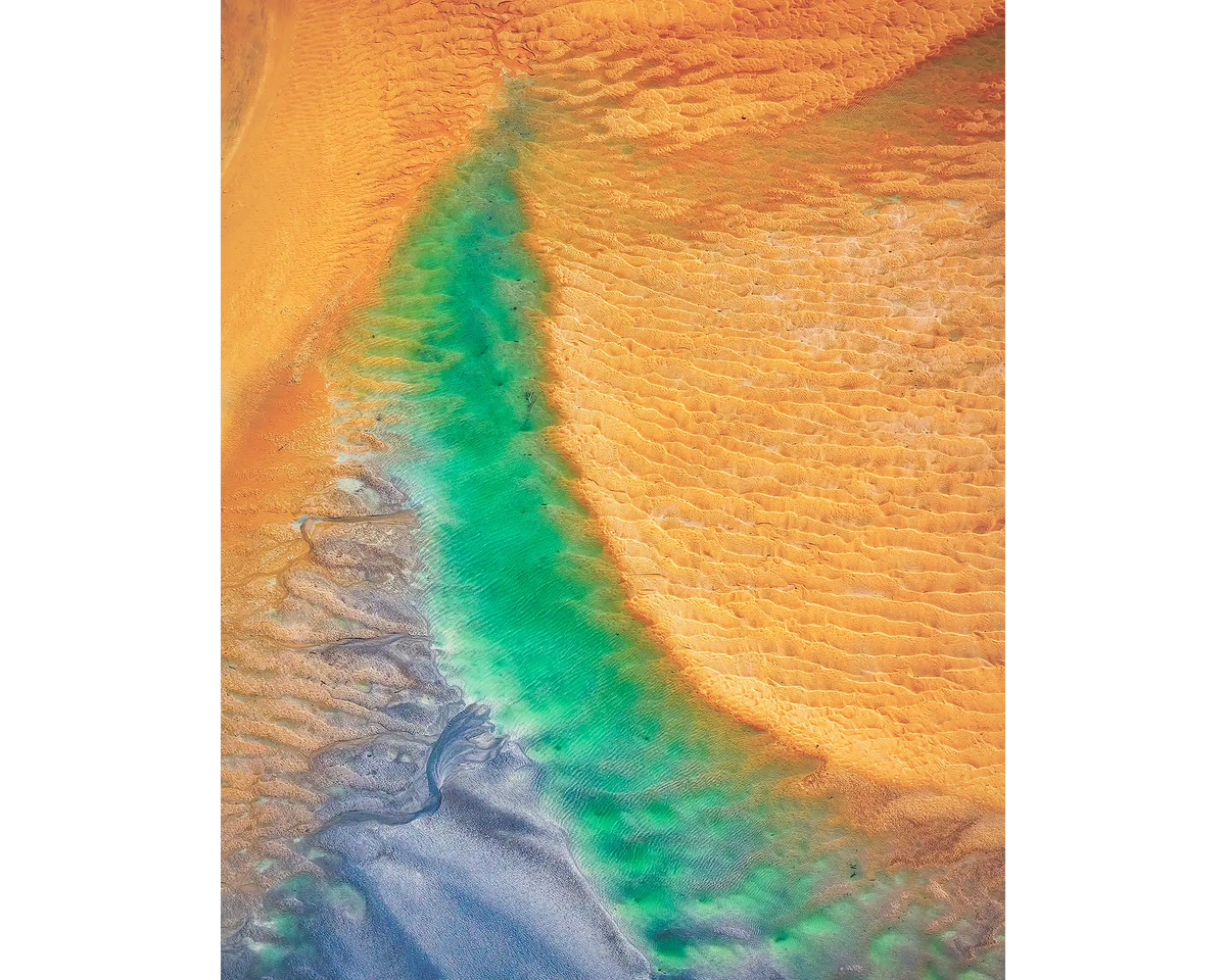 Opal Illusion. Aerial view of tidal patterns, Roebuck Bay, The Kimberley, Western Australia.