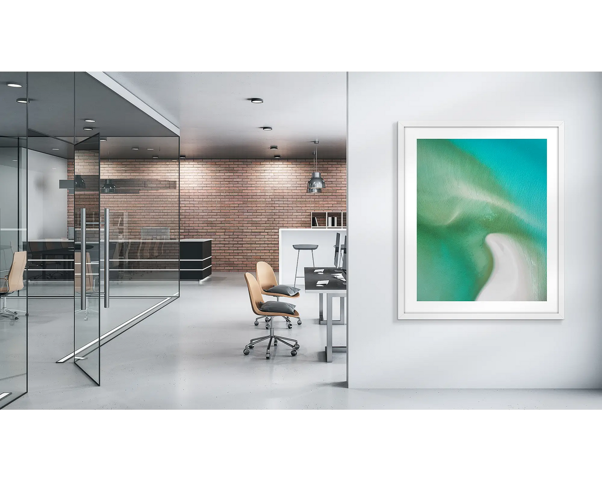Opal Waters. Whitsunday wall art print with a white frame, in a modern office. 