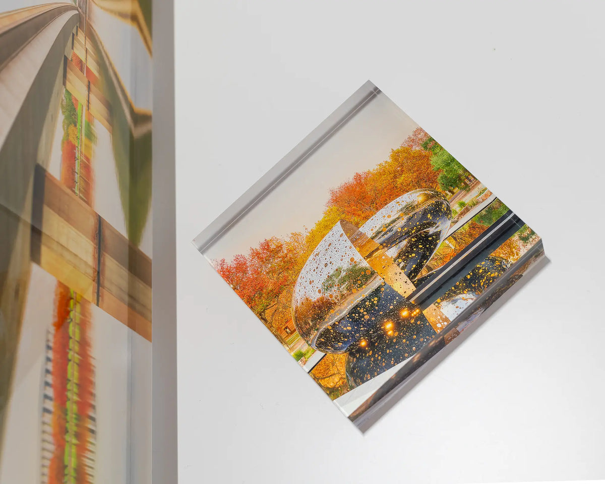 Orange Cocoon. Acrylic block of Ouroboros sculpture National Gallery of Australia, laying flat with large Canberra acrylic alongside.