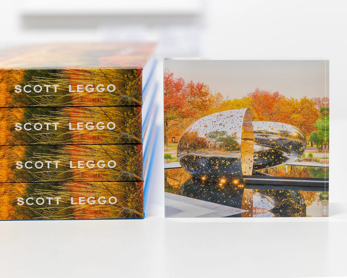 Orange Cocoon. Acrylic block of Ouroboros sculpture National Gallery of Australia, next to Scott Leggo book pile.