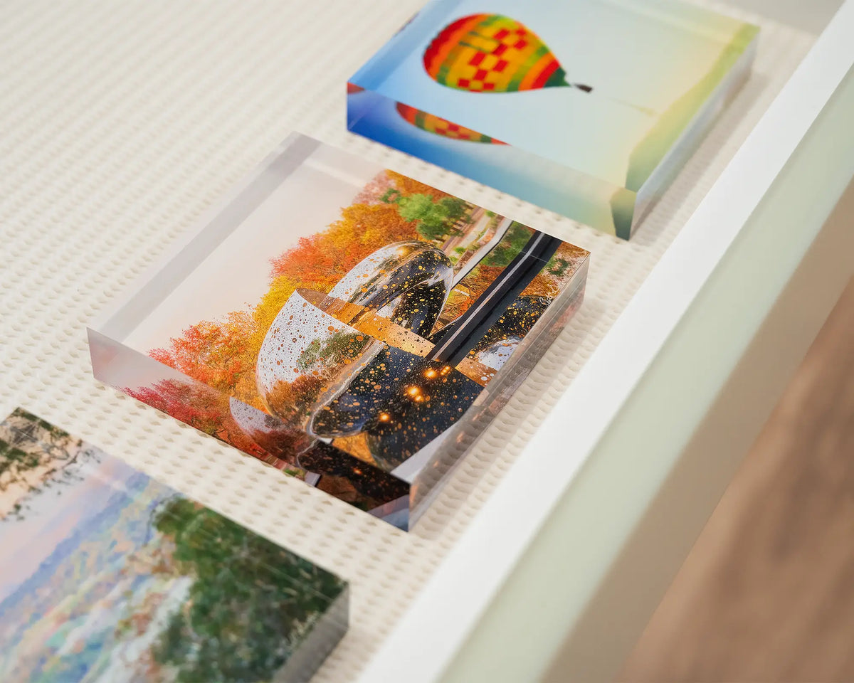Orange Cocoon. Small acrylic block of Ouroboros sculpture National Gallery of Australia, in gallery drawer with Canberra acrylic blocks.