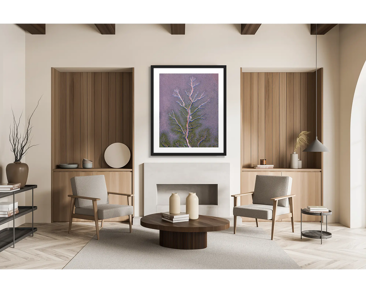Origin. Framed wall art print of an aerial view of the King River patterns, the Kimberly, with a black frame in a scandi inspired lounge room. 