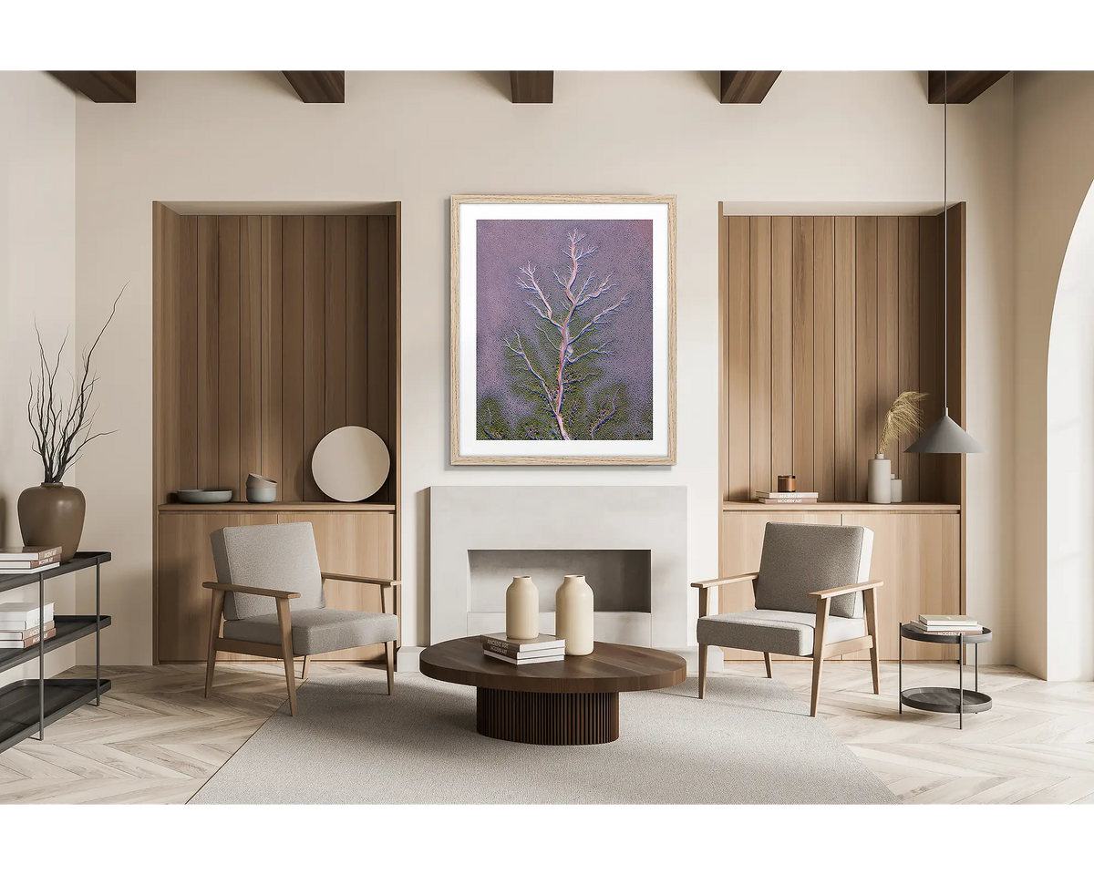 Origin. Framed wall art print of an aerial view of the King River patterns, the Kimberly, with a timber frame in a scandi inspired lounge room. 