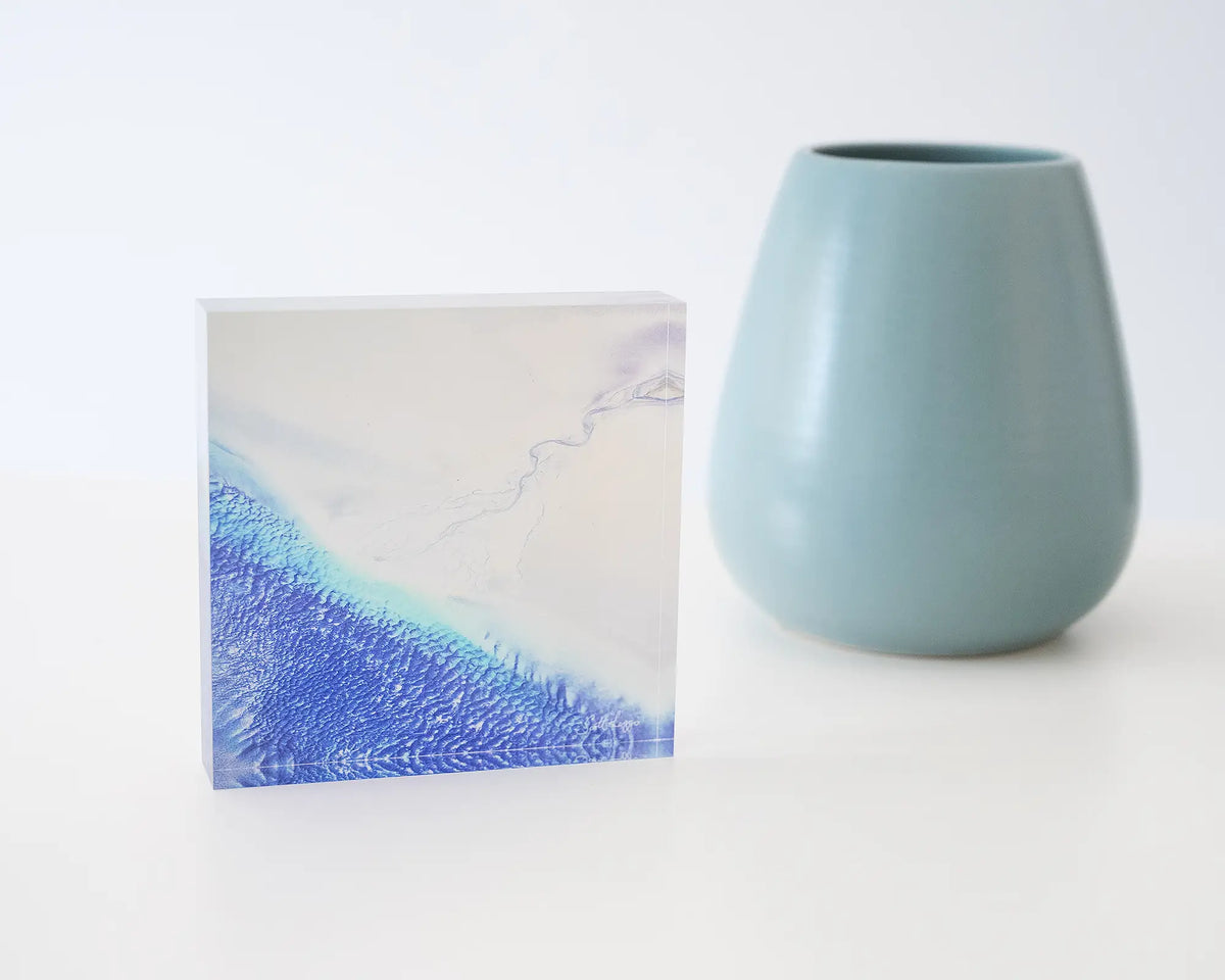 Outlet. Acrylic block of Roebuck Bay Western Australia, styled with a small vase.