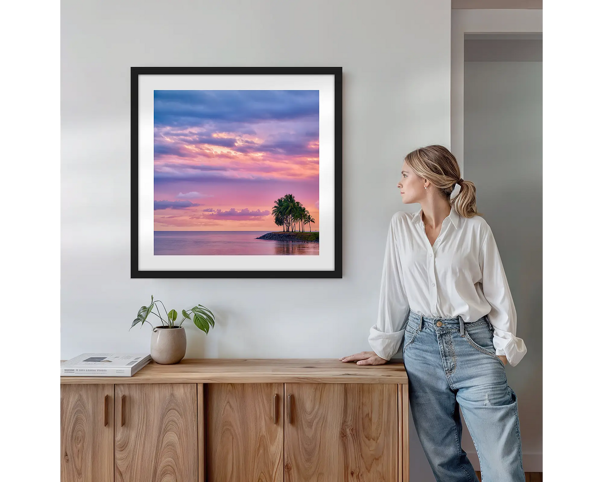 Paradise Palms. Wall art print with black frame featuring Port Douglas Queensland, hung above a side table.