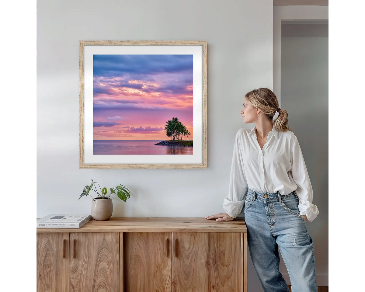 Paradise Palms. Wall art print with timber frame featuring Port Douglas Queensland, hung above a side table.