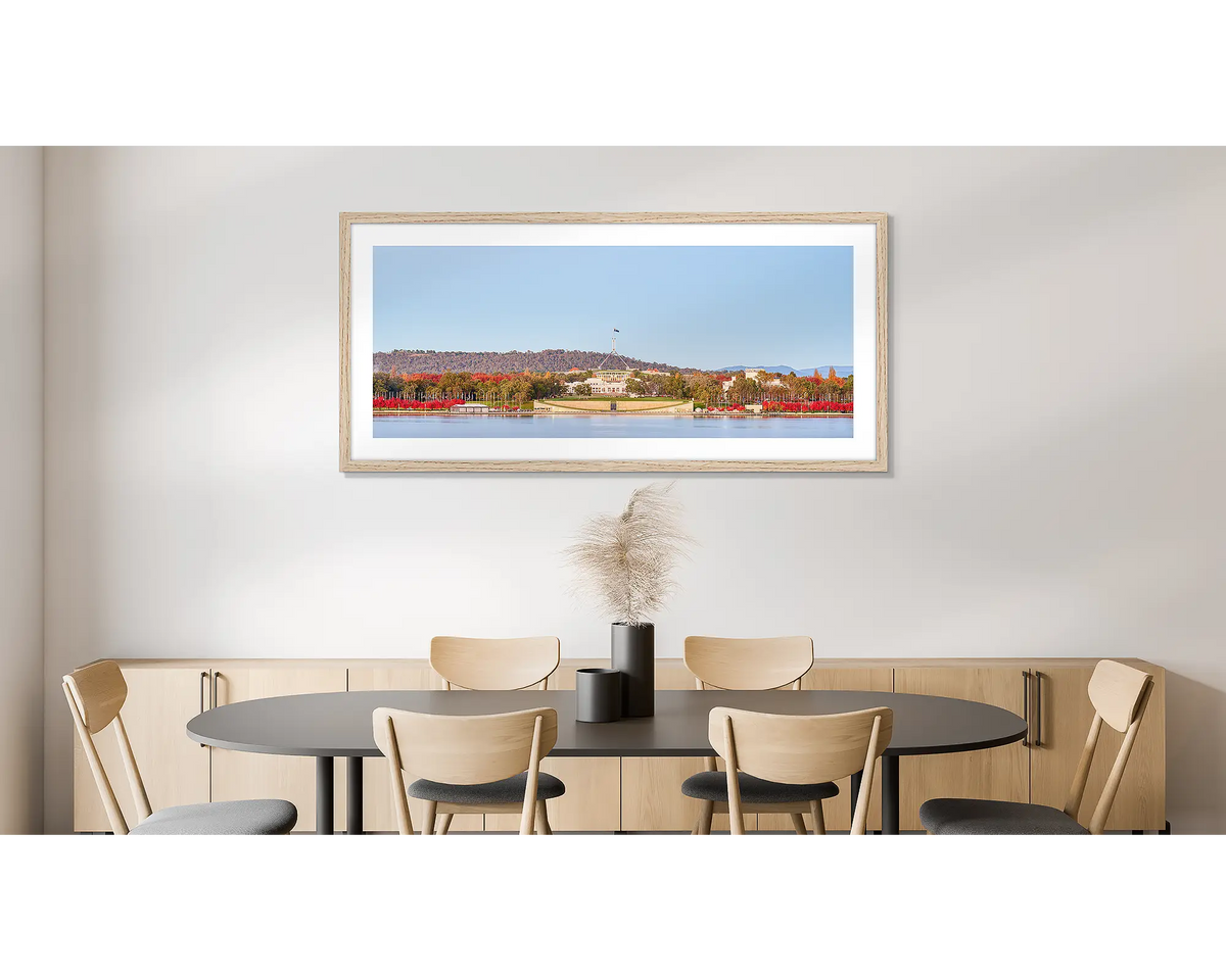 Parliamentary Reds. Photographic wall art print of old and new Parliament House, framed in a timber frame and hung on a dining room wall. 