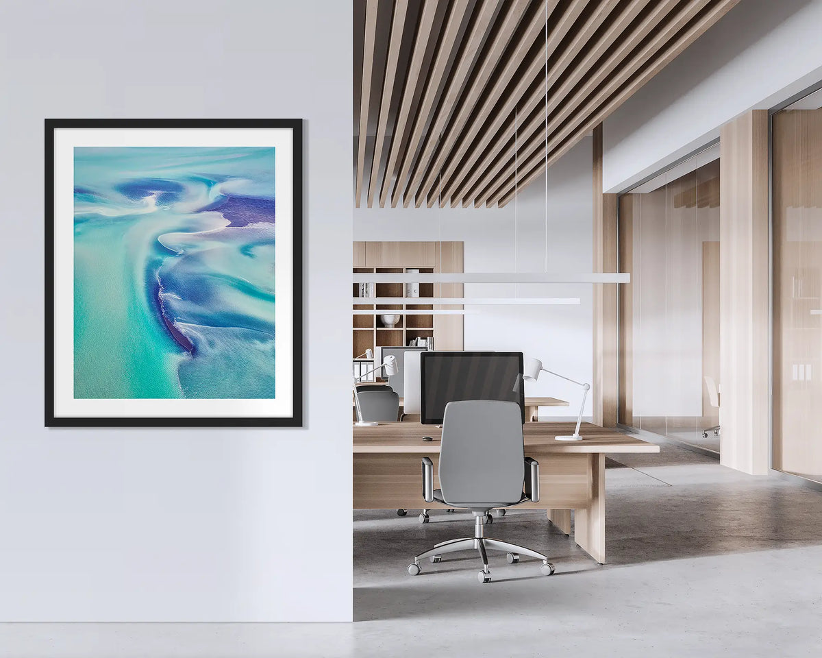 Permeate. Framed abstract Kimberley wall art with a black frame hung on an office wall. 