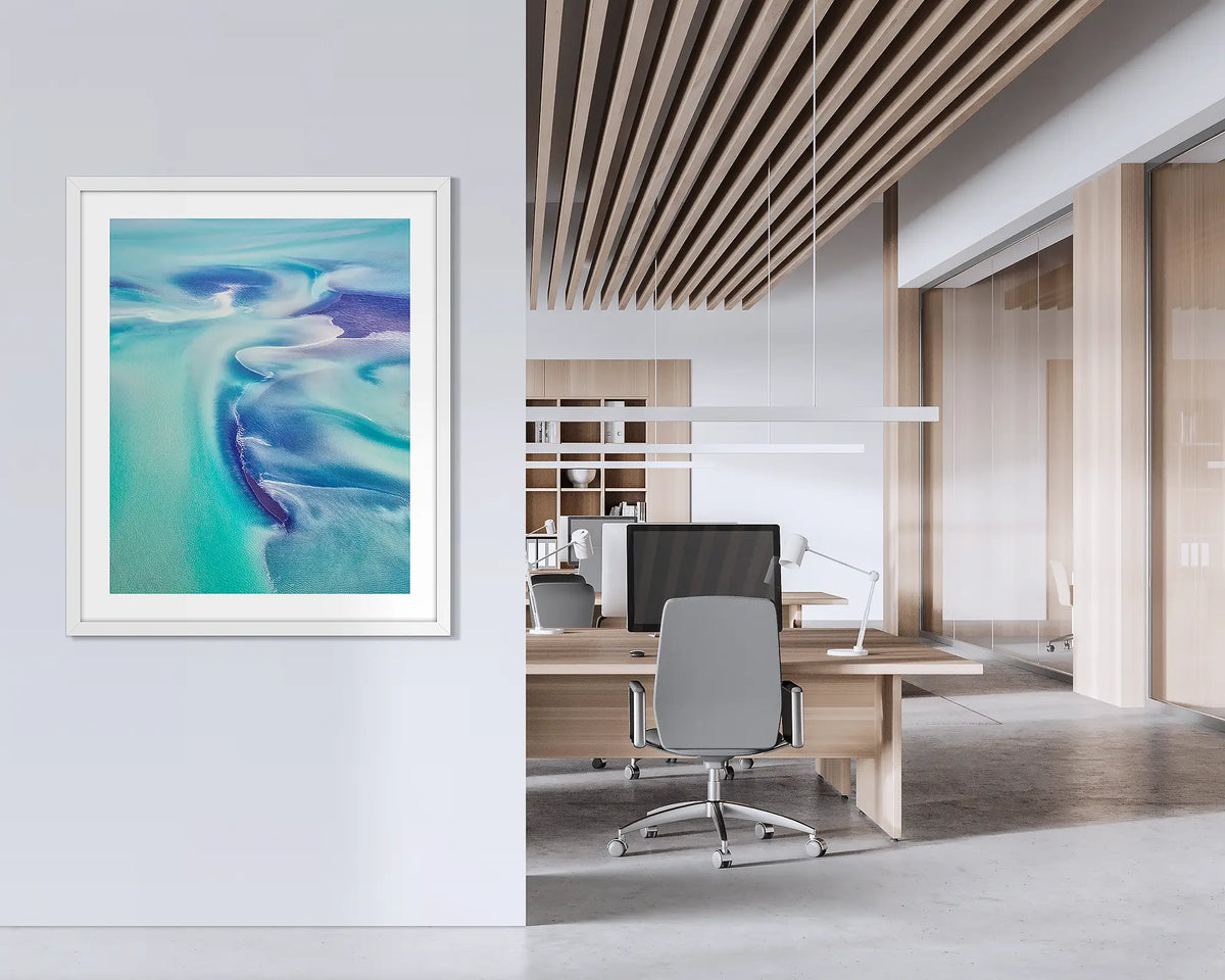 Permeate. Framed abstract Kimberley wall art with a white frame hung on an office wall. 