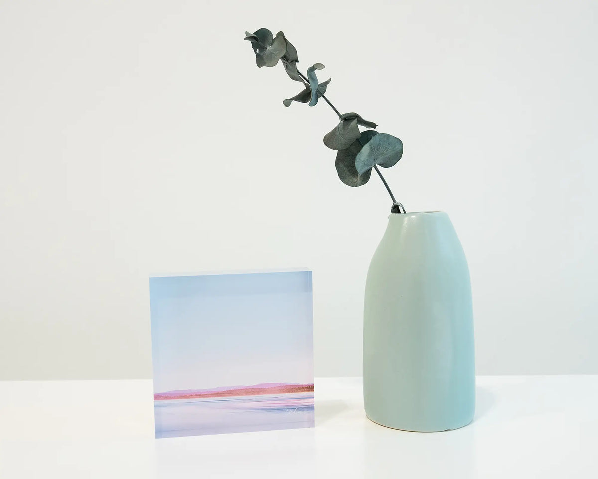 Perspective. Acrylic block of Pambula Beach Merimbula Beach New South Wales, styled with a small vase.