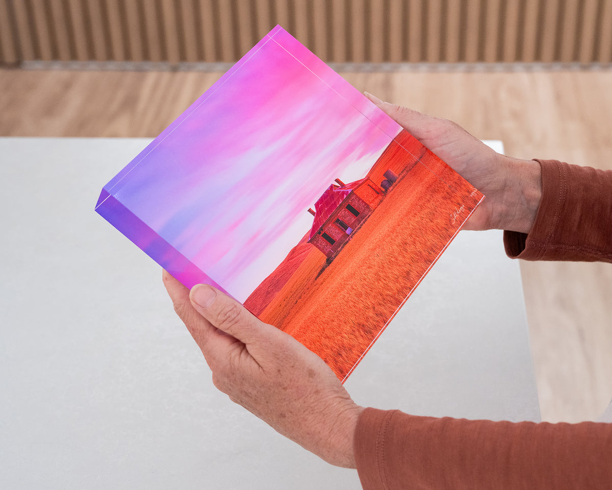 Pioneer. Acrylic block of Burra homestead South Australia, being hand held.
