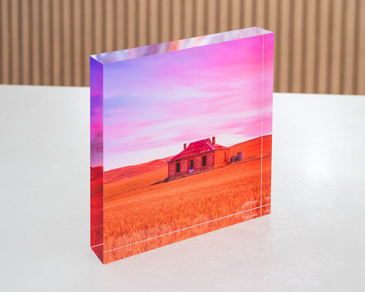 Pioneer. Acrylic block of Burra homestead South Australian outback, sitting on a desk.