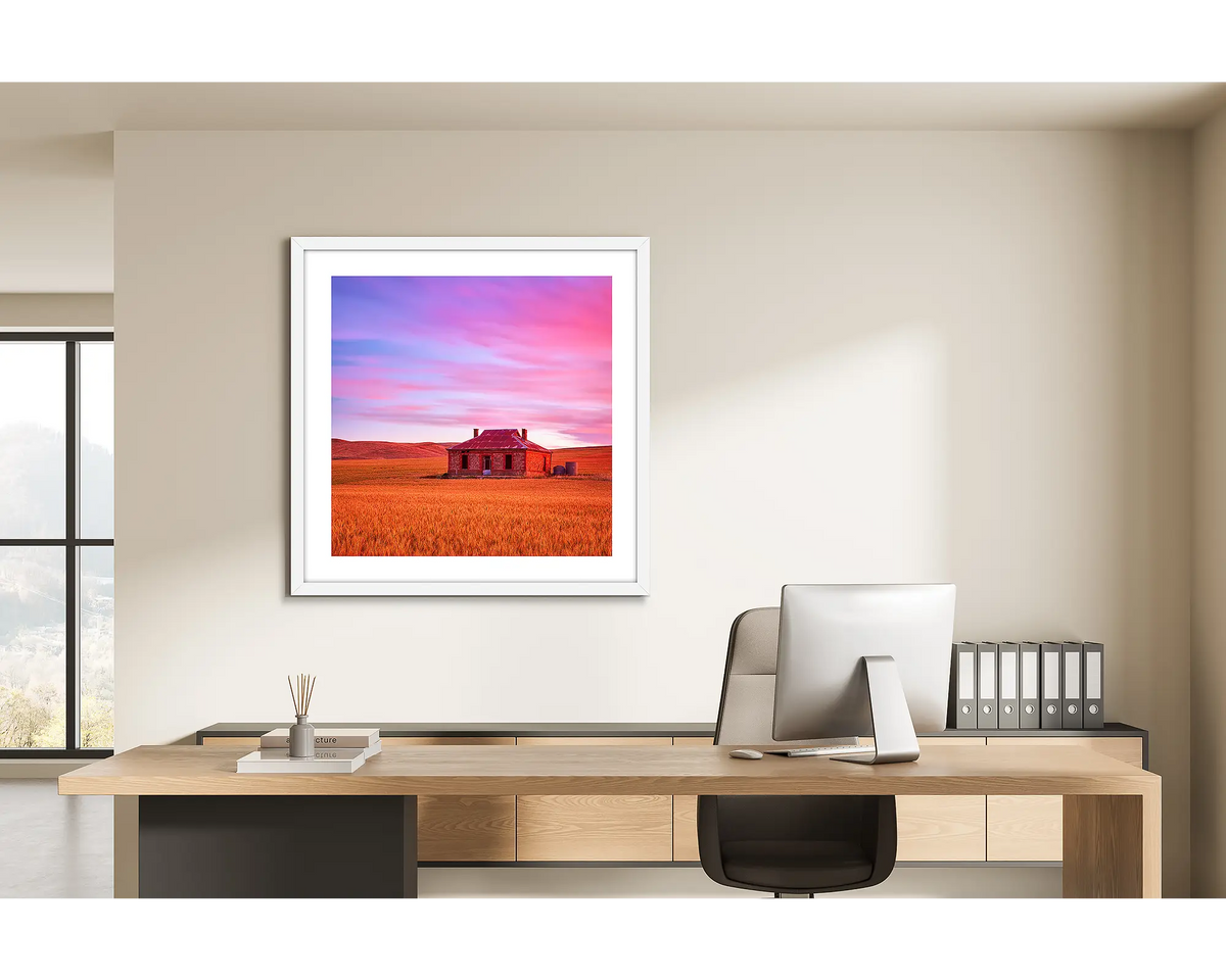 Pioneer. Framed wall art print of an outback farm home, framed with a white frame and hung in a light filled office. 