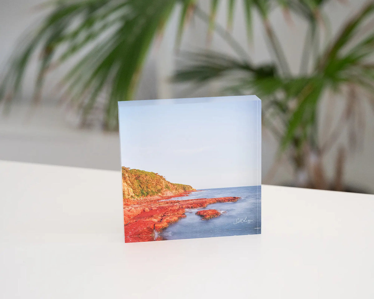Point. Acrylic block of a sunset at Merimbula Point, New South Wales, styled in a coastal home.