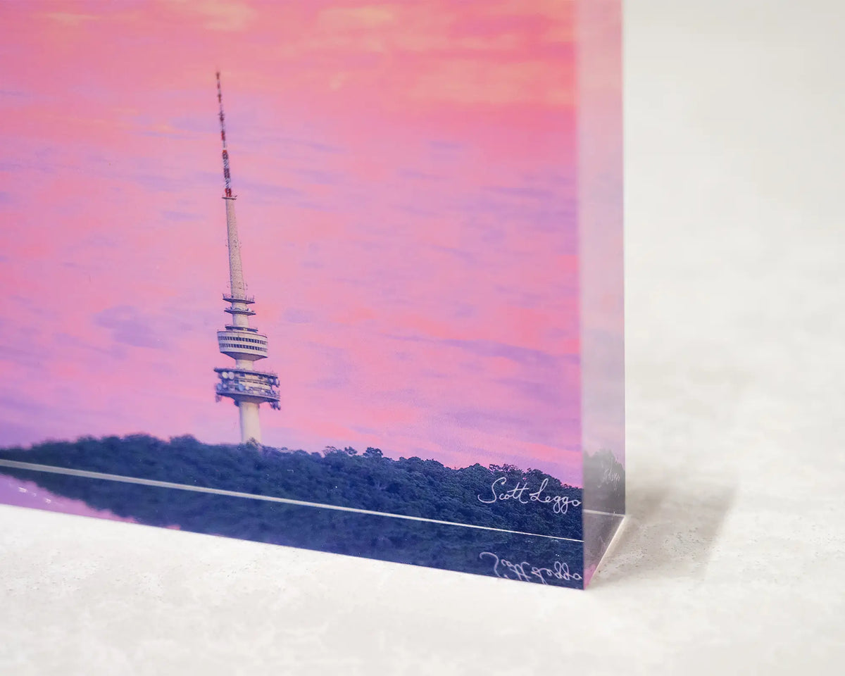 Pointer. Acrylic block of sunrise at Black Mountain Tower, corner close-up details.