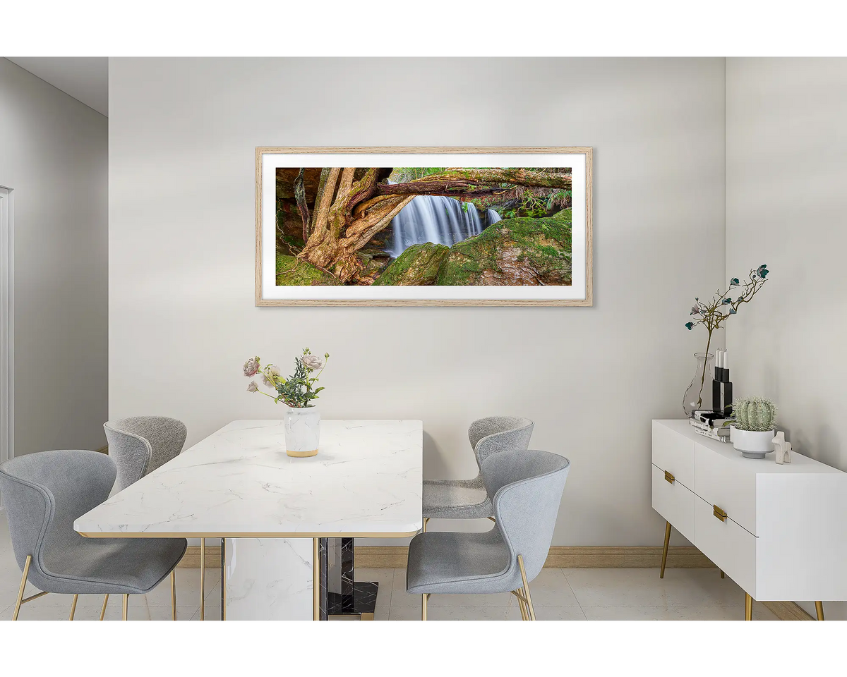 Protected Falls. Wall art print of a waterfall in Morton National Park, with a timber frame, hung in a dining room. 