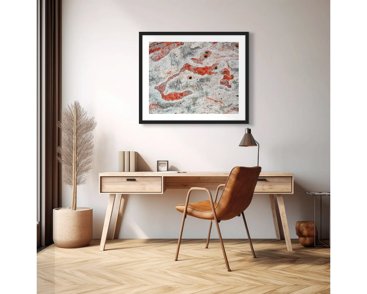 Pursuit. Abstract photographic wall art print with a black frame, hung above a scandi office desk. 