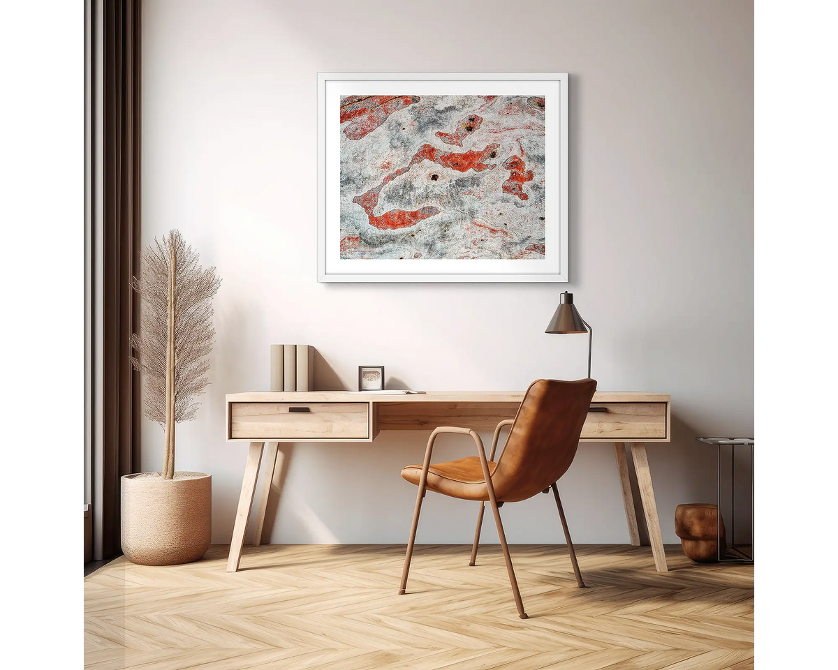 Pursuit. Abstract photographic wall art print with a white frame, hung above a scandi office desk. 