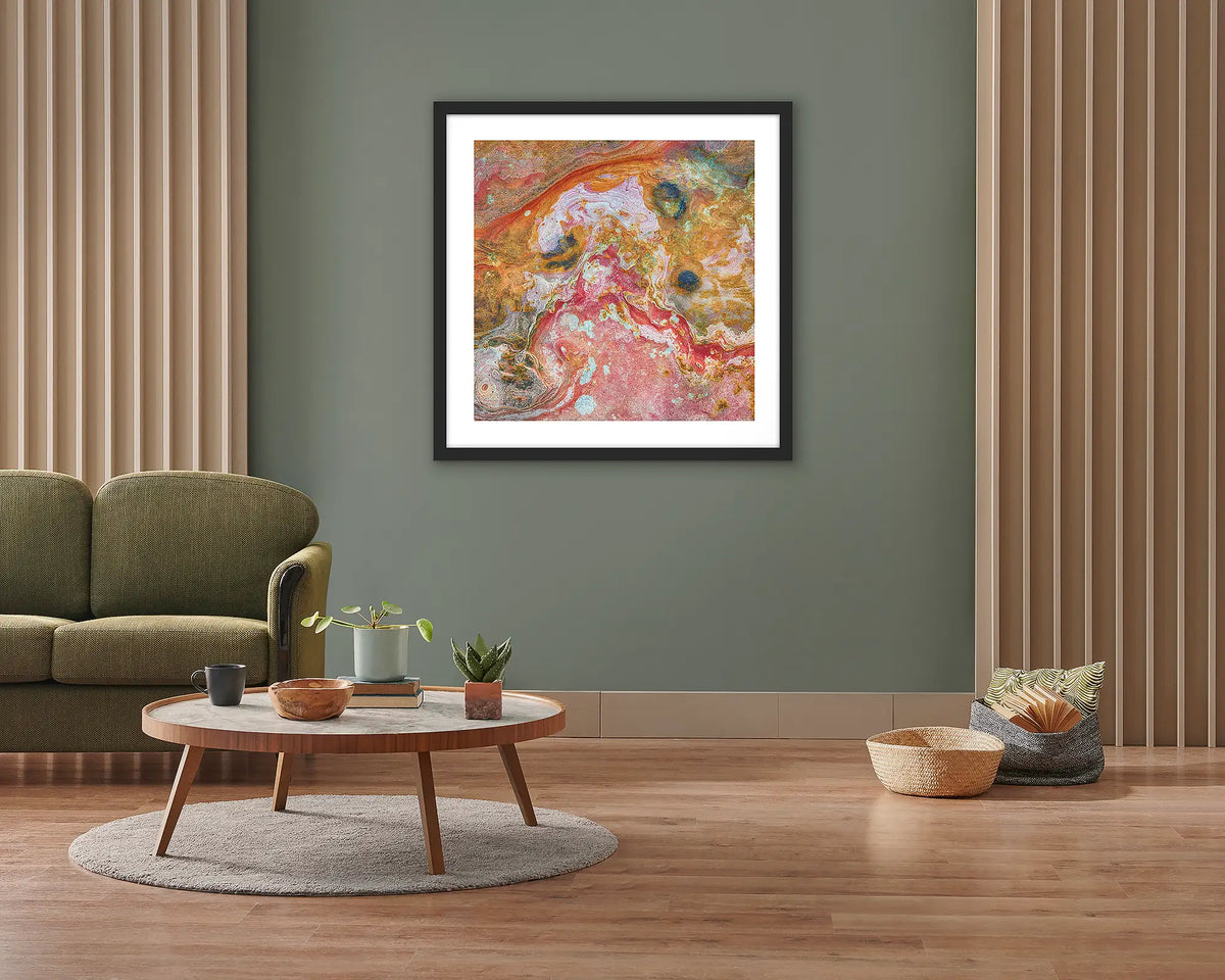 Rainbow Rock. Framed wall art print of Kimberley rock patterns, with a black frame, hung on a lounge room wall. 