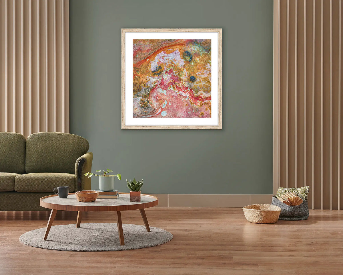 Rainbow Rock. Framed wall art print of Kimberley rock patterns, with a timber frame, hung on a lounge room wall. 