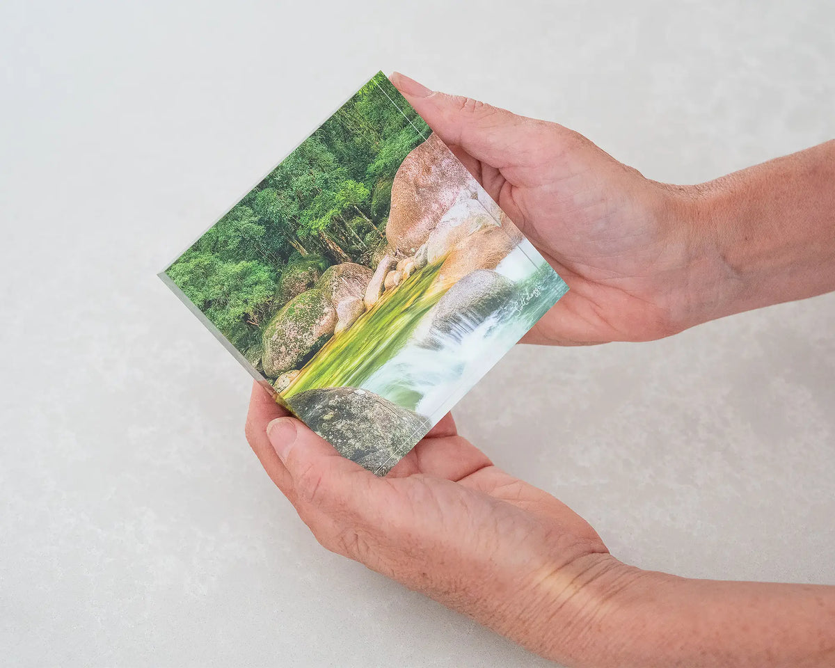 Rainforest Rocks. 10cm acrylic block of Mossman Gorge Queensland, being held in hands.